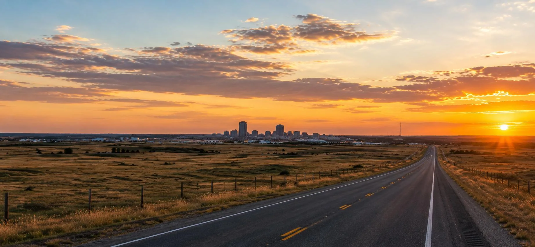 The highway leading into Amarillo at sunset